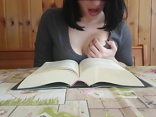 Reading books is so arousing that a brunette orgasms during it